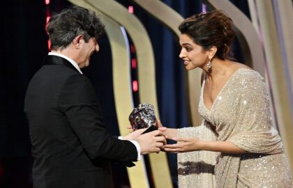 Deepika Padukone Presents Jonathan Glazer With The Best Film Award For The Zone Of Interest At BAFTA 2024.