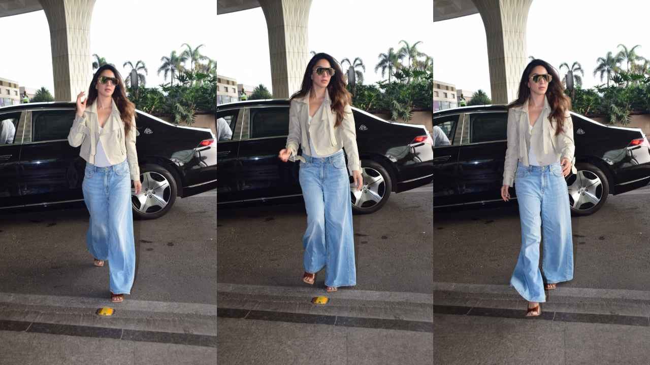 With Her Million-dollar Smile, Kiara Advani Dishes Up Airport-style Inspiration While Sporting A Beige Cropped Blazer And Wide-legged Trousers