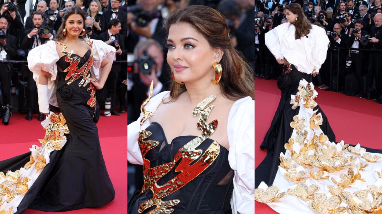 Aishwarya Rai Looks Like A Floral Fairy , Outfitted In A Black Gown Adorned With A Long Trail
